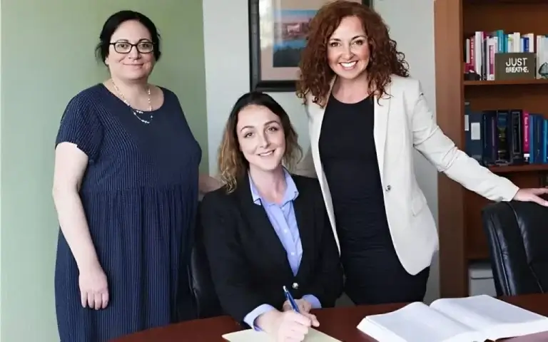 Standish & Conlin team in office setting